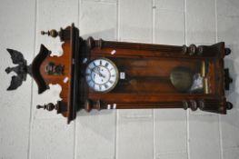 A 19TH CENTURY WALNUT CASED EIGHT DAY GUSTAV BECKER WALL CLOCK, the pediment depicting an eagle,