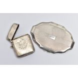 A SILVER VESTA CASE AND A COMPACT, the vesta of a rounded rectangular form, polished design with