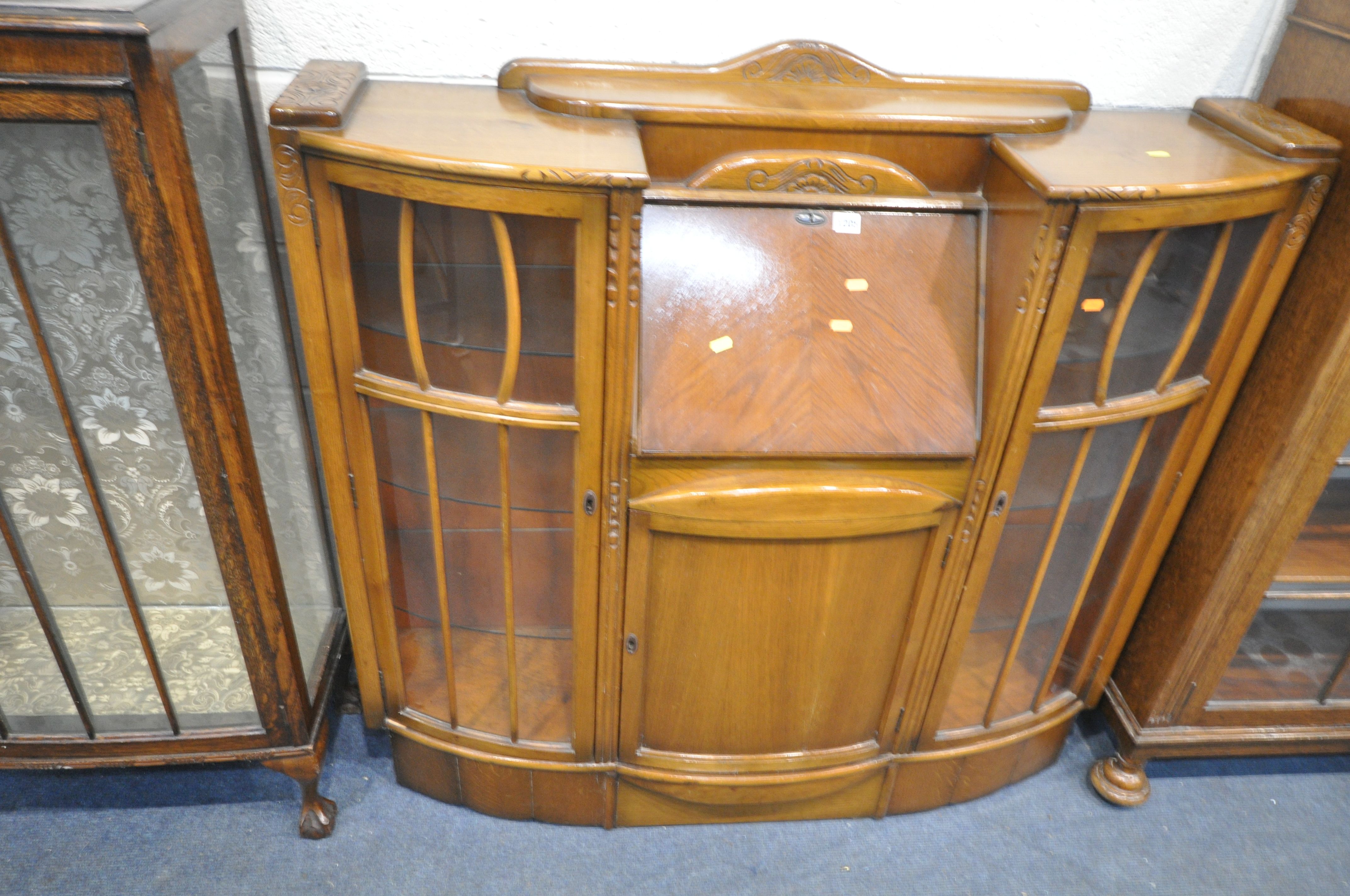 A 20TH CENTURY OAK SIDE BY SIDE BUREAU BOOKCASE, two glazed doors flanking a fall front door, - Image 3 of 4