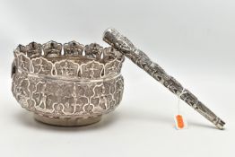 AN INDIAN WHITE METAL BOWL, with multi-point cut rim, repousse decorated throughout with deities and