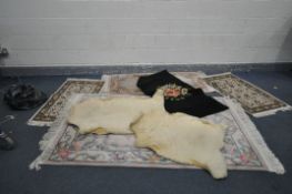SEVEN VINATGE RUGS AND RUNNERS including two sheep skin rugs 110cm and 95cm long, a large wool twist