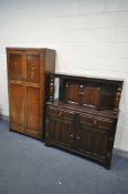 AN OAK COURT CUPBOARD with two drawers, length 123cm x depth 47cm x height 141cm, and an oak paneled
