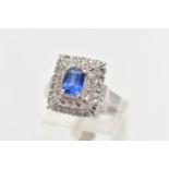 A SAPPHIRE AND DIAMOND CLUSTER RING, set with a rectangular cushion shape sapphire, measuring