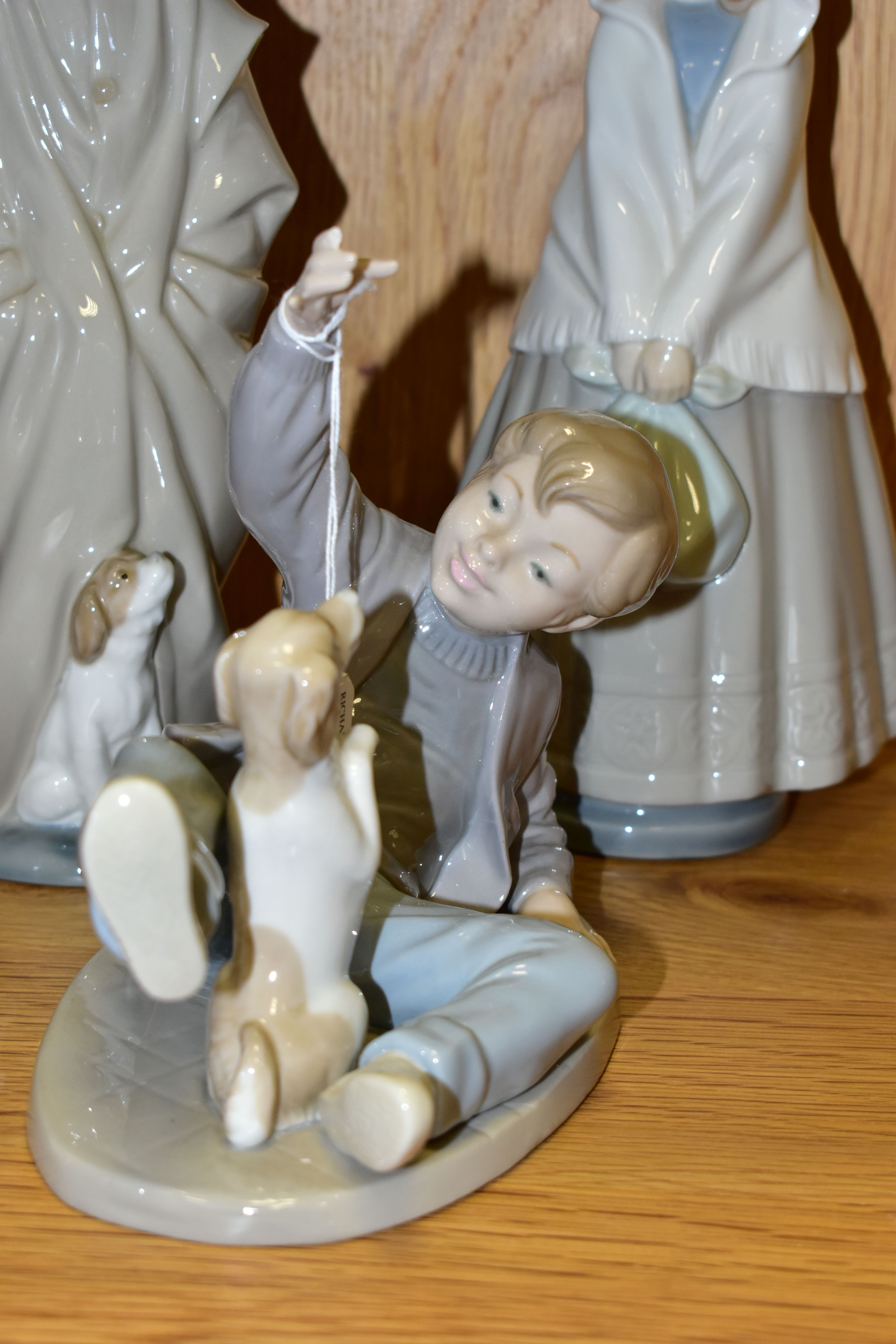 FOUR NAO FIGURES OF CHILDREN, comprising a boy with pillow and alarm clock (glued repair to the - Image 2 of 4