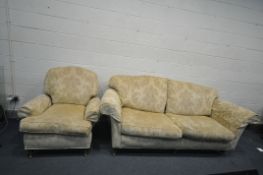 A TWO PIECE OATMEAL AND GOLD LOUNGE SUITE comprising of a large two seat sofa 236cm wide, standing