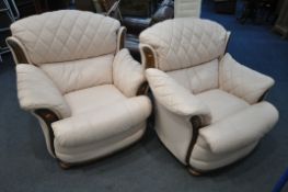 A PAIR OF LEATHER ARMCHAIRS