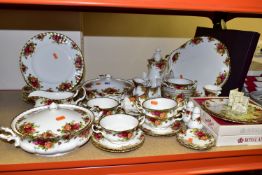 A GROUP OF ROYAL ALBERT DINNERWARE AND COFFEE SET, comprising two lidded tureens, six dinner plates,