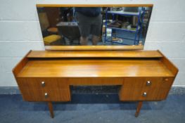 A MID CENTURY TEAK DRESSING TABLE, with a single rectangular mirror, a raised shelf, five various