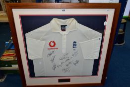 A FRAMED AND GLAZED MARCUS TRESCOTHICK MATCHWORN ENGLAND CRICKET SHIRT, worn during the 2002-2003