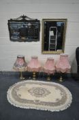 A GILT FRAMED MIRROR WITH BEVELLED GLASS and rope and swag detailing width 97cm x height 76cm ,