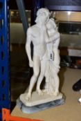 A FIGURE GROUP OF VENUS AND ADONIS, cast in resin on a stone base, height 38cm x width 19cm x
