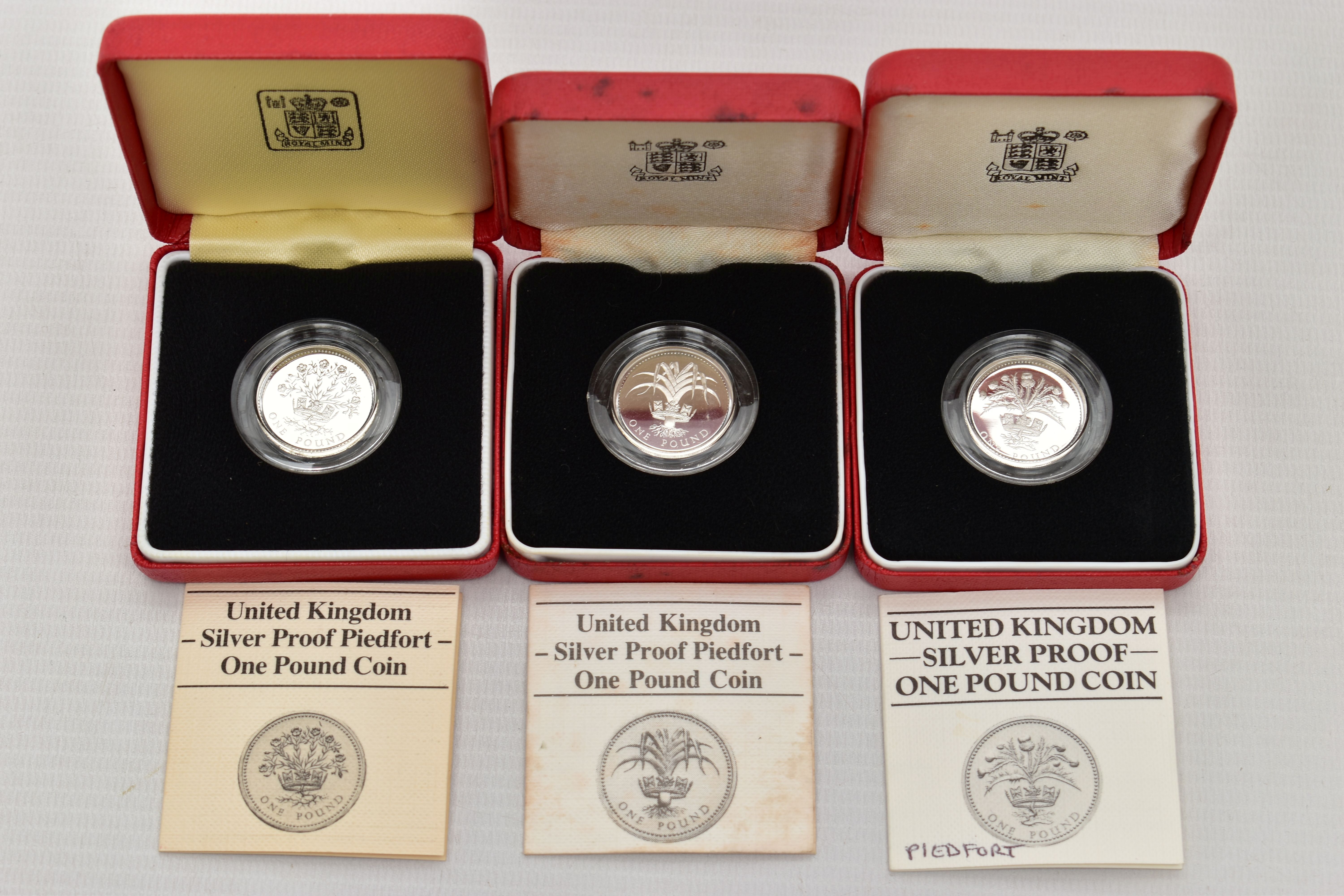 ROYAL MINT BOXED SILVER PROOF PIEDFORT ONE POUND COINS 1984,1985,1986 all in Royal Mint cases with