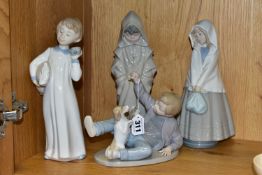 FOUR NAO FIGURES OF CHILDREN, comprising a boy with pillow and alarm clock (glued repair to the