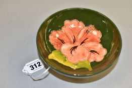 A MOORCROFT POTTERY PINK HIBISCUS FOOTED BOWL, with tubelined pink hibiscus pattern to interior on a