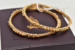 TWO ASIAN GOLD BANGLES, each designed with spherical bead accents, engraved and rope twist detail,