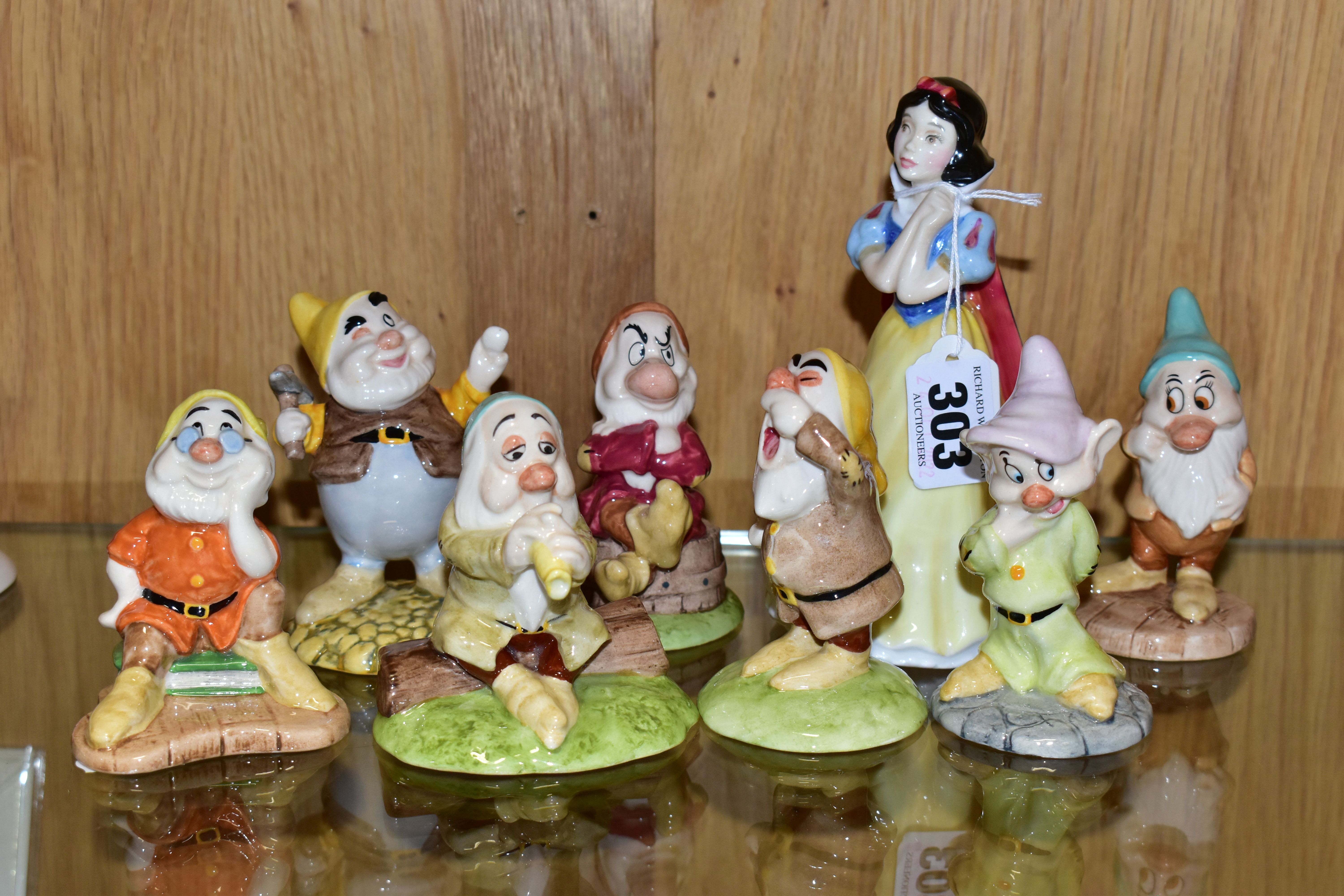 EIGHT BOXED ROYAL DOULTON FIGURES FROM SNOW WHITE AND THE SEVEN DWARFS, comprising Snow White SW9,