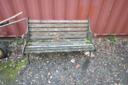 A CAST IRON ENDED GARDEN BENCH with wooden slatted seat and back width 126cm