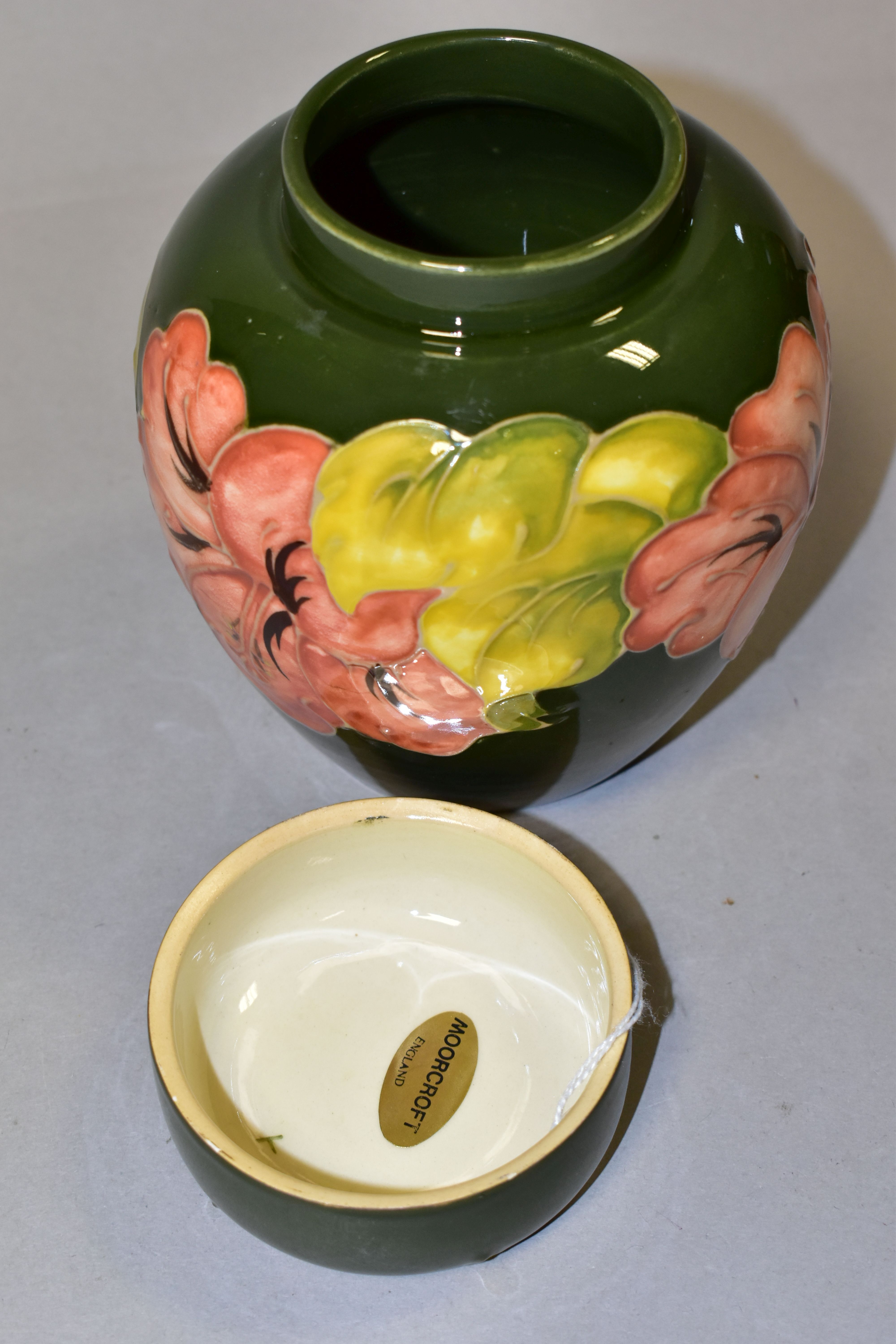 A MOORCROFT POTTERY GINGER JAR AND COVER, in the Coral Hibiscus pattern on a green ground, bears - Image 4 of 5