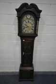A 20TH CENTURY CARVED OAK EIGHT DAY LONGCASE CLOCK, the hood enclosing a 11 inch brass and