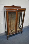 A MAHOGANY TWO DOOR DISPLAY CABINET, on ball and claw feet, width 75cm x depth 33cm x height 130cm