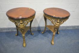 A PAIR OF GILT CAST IRON CIRCULAR PUB TABLES, with a mahogany top, diameter 60cm x height 76cm (