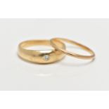 TWO 9CT GOLD RINGS, the first a single stone diamond ring, set in a yellow gold domed band mount,