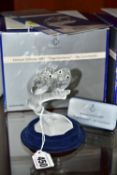 A BOXED SWAROVSKI COLLECTORS SOCIETY ANNUAL FIGURE FROM CARING AND SHARING TRILOGY - '