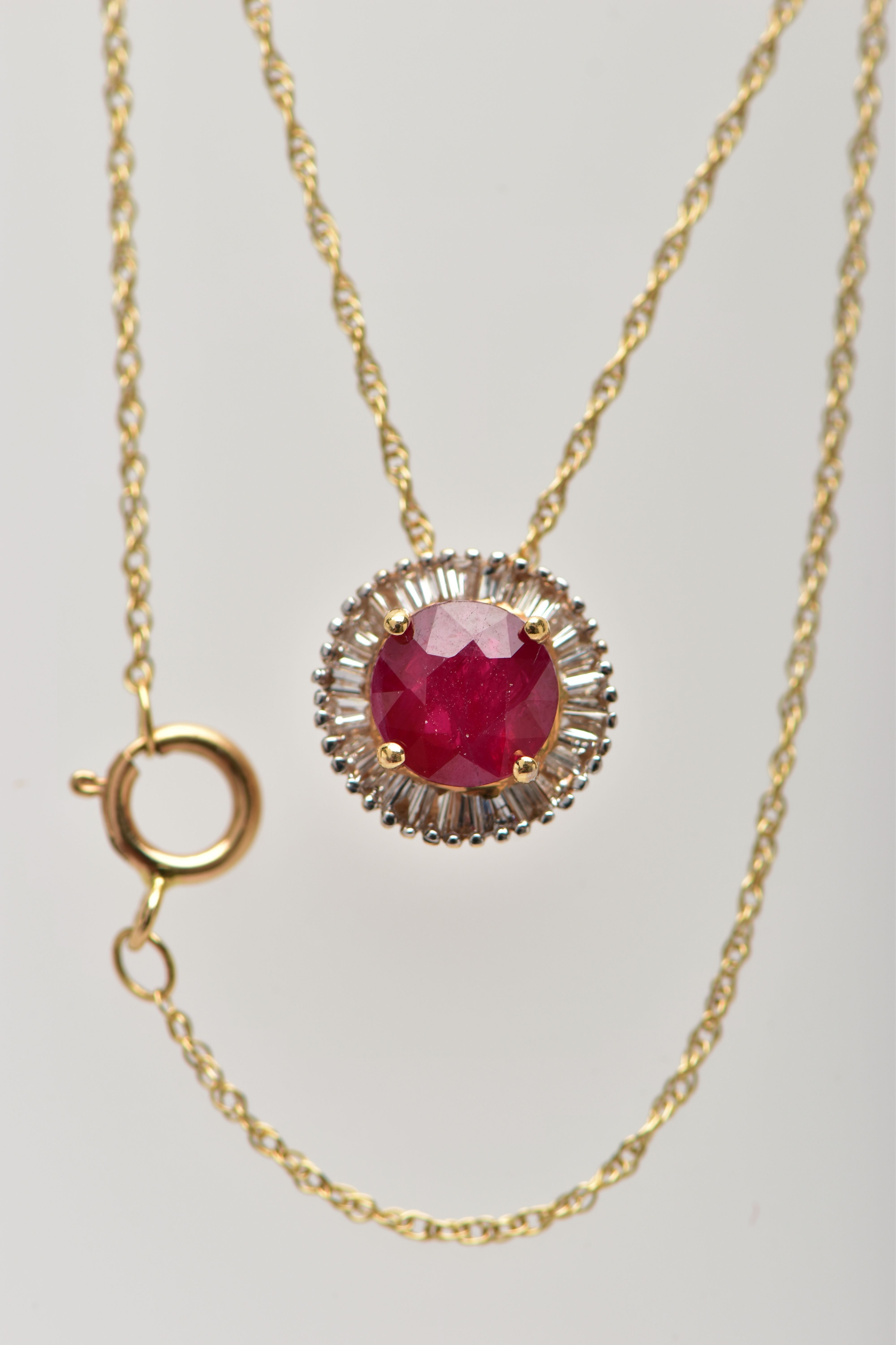 AN 18CT YELLOW GOLD GLASS FILLED RUBY AND DIAMOND CLUSTER PENDANT, WITH YELLOW METAL CHAIN, the