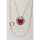 AN 18CT YELLOW GOLD GLASS FILLED RUBY AND DIAMOND CLUSTER PENDANT, WITH YELLOW METAL CHAIN, the