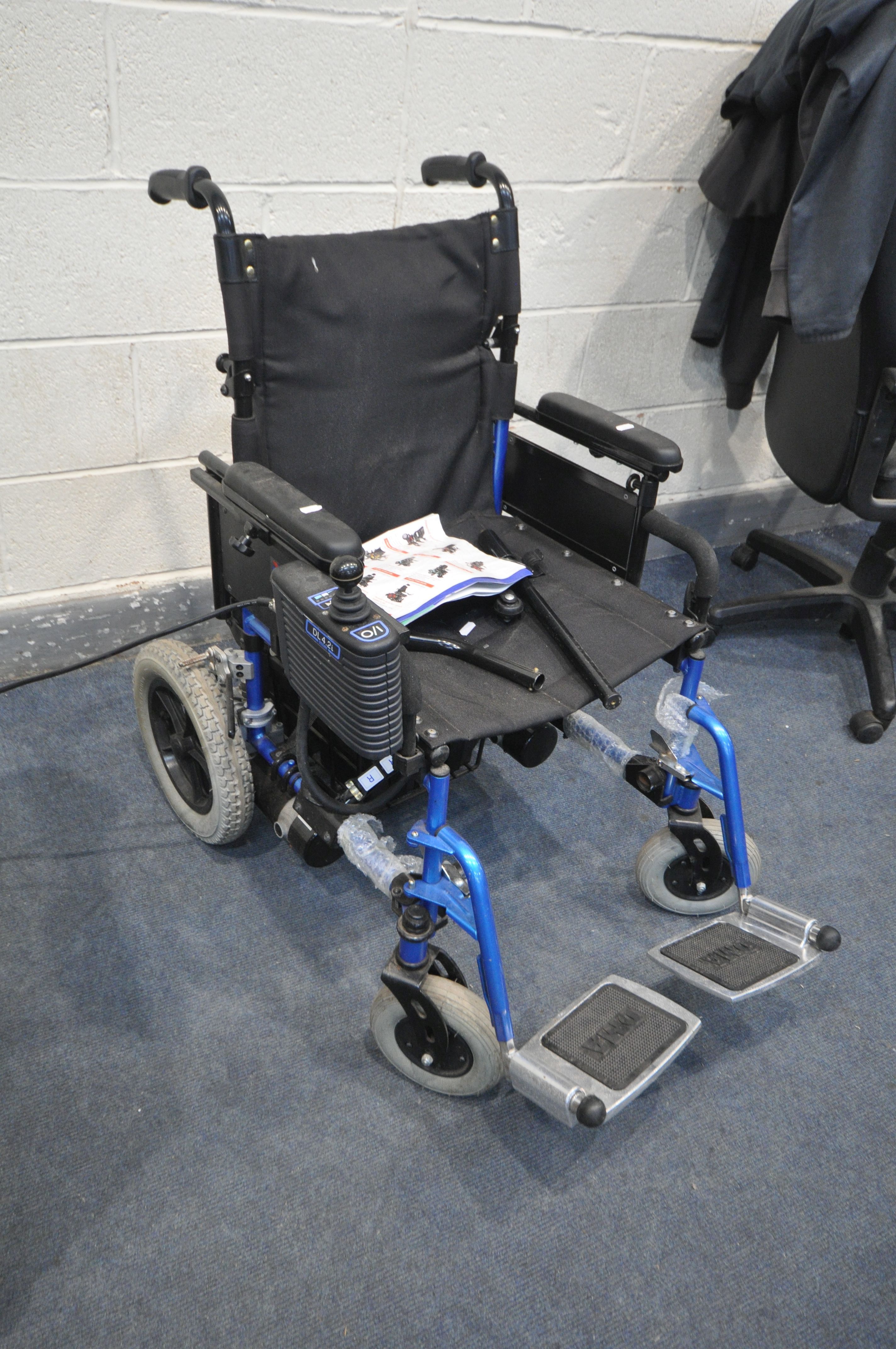 A DMA DL4.2i ELECTRIC WHEELCHAIR with power supply, two footrest and two flip bars ( PAT pass but