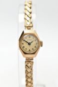 A 9CT GOLD WRISTWATCH, hand wond movement, round dial signed 'Visible', Arabic numerals, polished