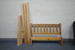 A PINE 4ft6 BED FRAME with fixing screws (Condition:- some minor scuffs)