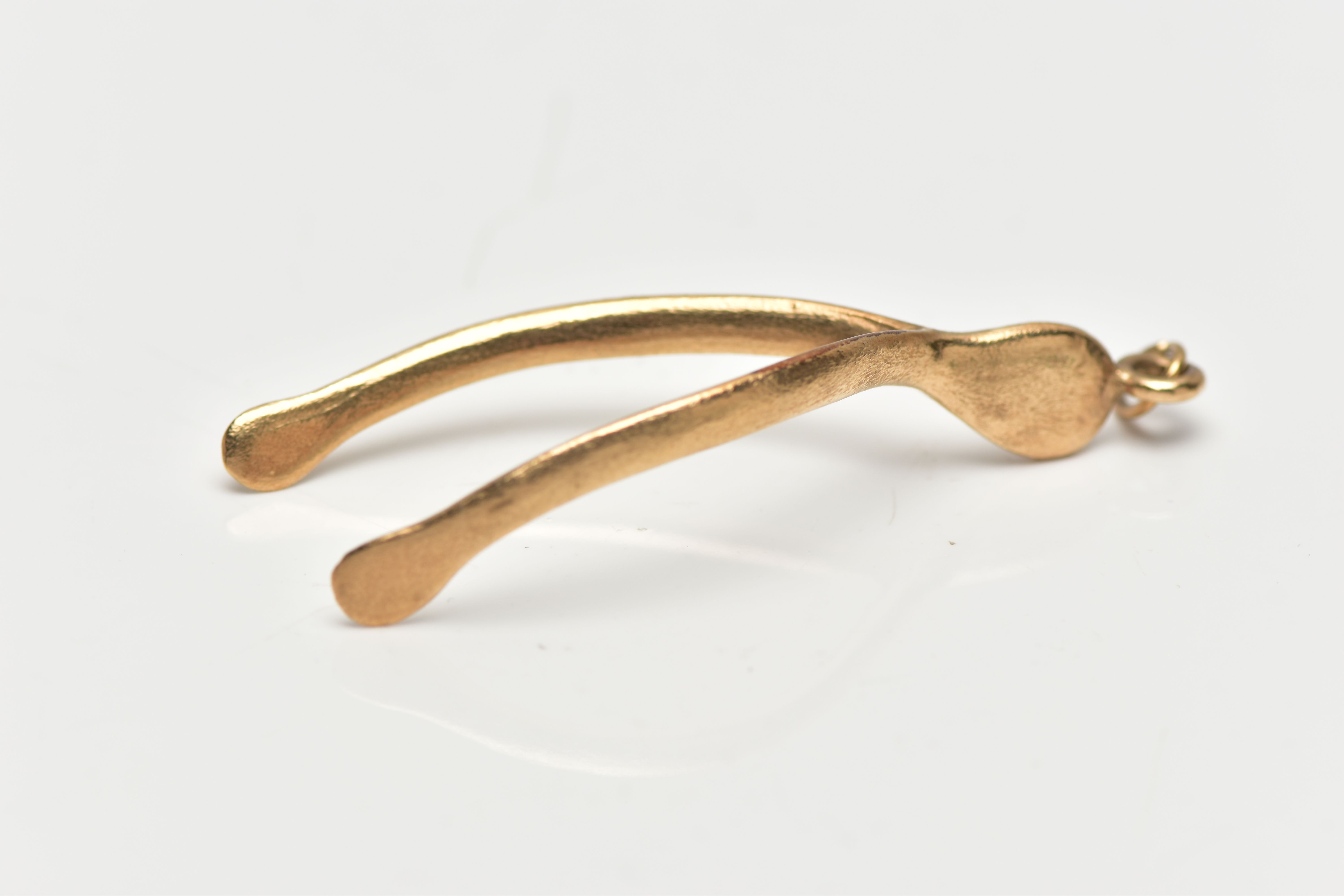 A 1970s 9CT YELLOW GOLD WISH BONE PENDANT, the pendant of plain polished design, approximate