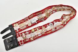 A RED AND WHITE MILITARY STYLE STABLE BELT, which has had mounted over 45 Military Badges, Cap