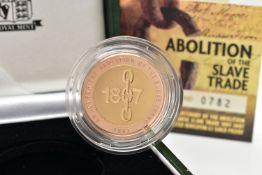 A ROYAL MINT 2007 GOLD PROOF ABOLITION OF THE SLAVE TRADE TWO POUND COIN, with red and yellow gold