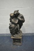 A MODERN PAINTED COMPOSITE ORNAMENTAL FIGURE of embracing lovers standing on a square plinth 111cm