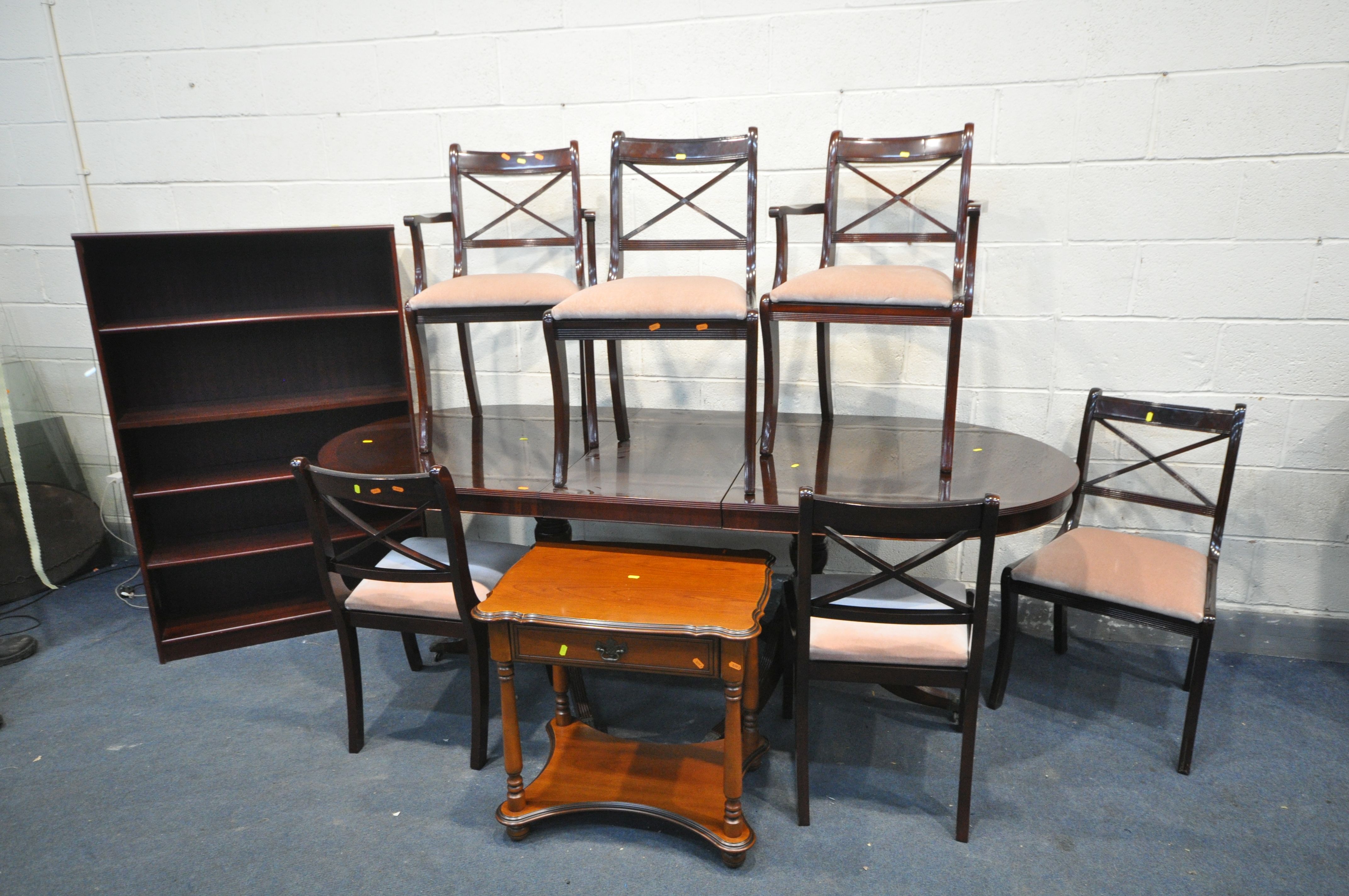 A MODERN MAHOGANY EXTENDING DINING TABLE and six chairs, extended table length 218cm x closed length