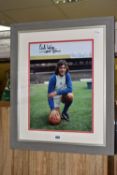 A SIGNED COLOUR PHOTOGRAPH OF TREVOR FRANCIS, Francis is wearing the blue and white 'penguin' kit,
