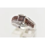 A 9CT WHITE GOLD DIAMOND DRESS RING, the calibre cut brown diamond central cluster, with brilliant