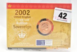 A ROYAL MINT CARDED 'THE QUEENS GOLDEN JUBILEE' 2002 UNITED KINGDOM BUILLION SOVEREIGN COIN, 22.