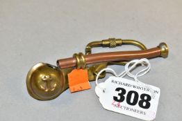 A COPPER AND BRASS BOSUN'S WHISTLE, with raised anchor decoration, length 8.5cm, attached to a key