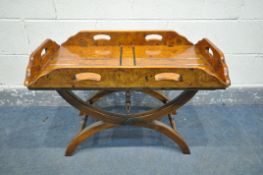 A REPRODUCTION BURR WALNUT BUTLERS TRAY, on separate cross framed base, width 83cm x depth 50cm x