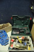 A METABO BST9.6 DRILL in case with battery and Metabo IC25 charger along with three tubs of drill
