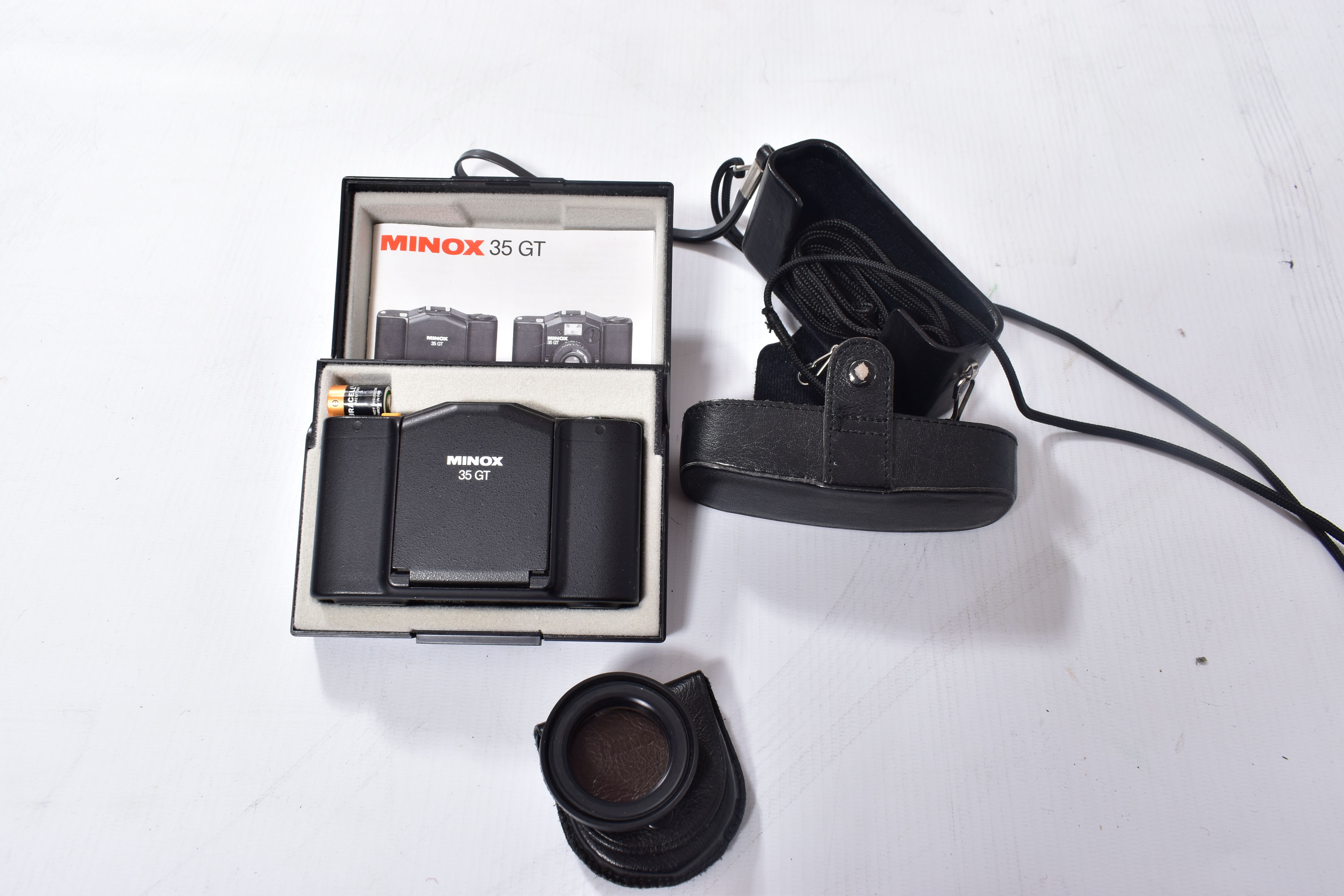 A MINOX 35GT FILM CAMERA in case with a leather pouch