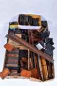 FIVE TRAYS CONTAINING VINTAGE FIELD CAMERA AND TRIPOD PARTS including plate carriers, a lens