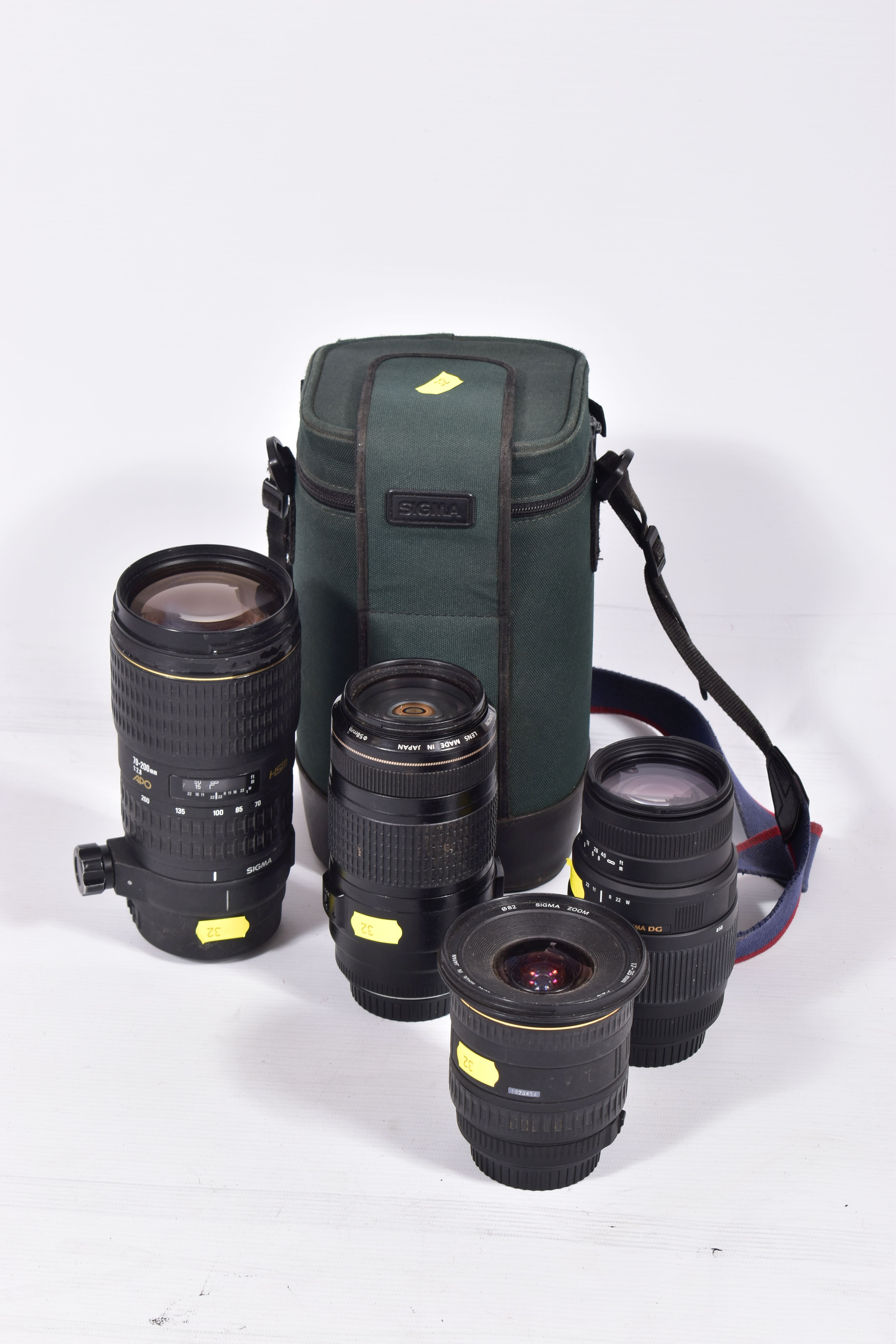 FOUR CANON AND CANON FIT ZOOM LENSES comprising of a Canon 70-300 f4 EF IS USM lens, a Sigma 70-