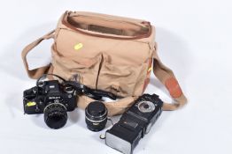 A CANVAS CAMERA BAG CONTAINING A NIKON F2 PHOTAMIC FILM SLR CAMERA, with a Micro Nikkor 55mm f3.5