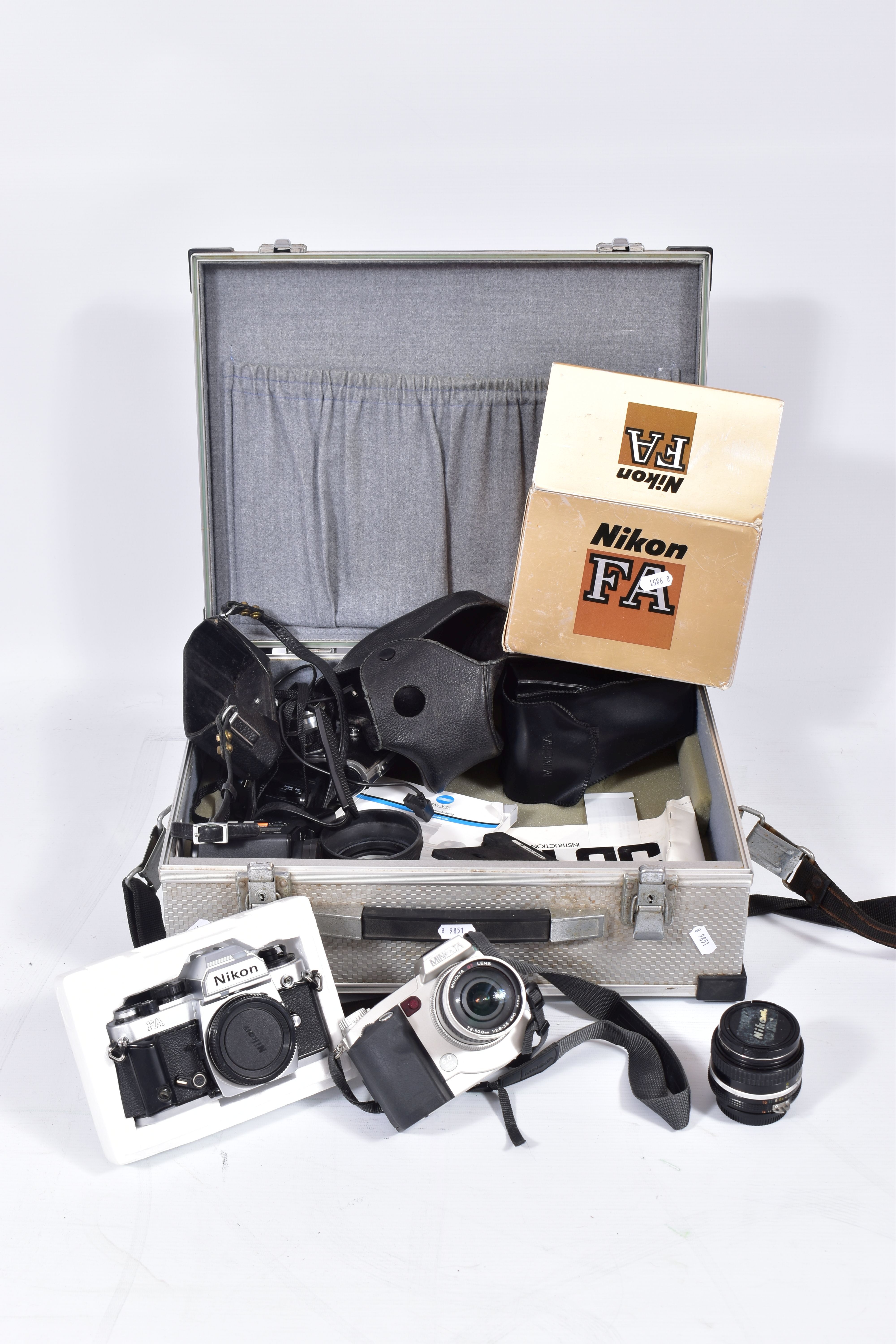 AN ALUMINIUM CASE CONTAINING A NIKON FA FILM SLR BODY in box( doesn't appear to Wind on ) a Nikkor