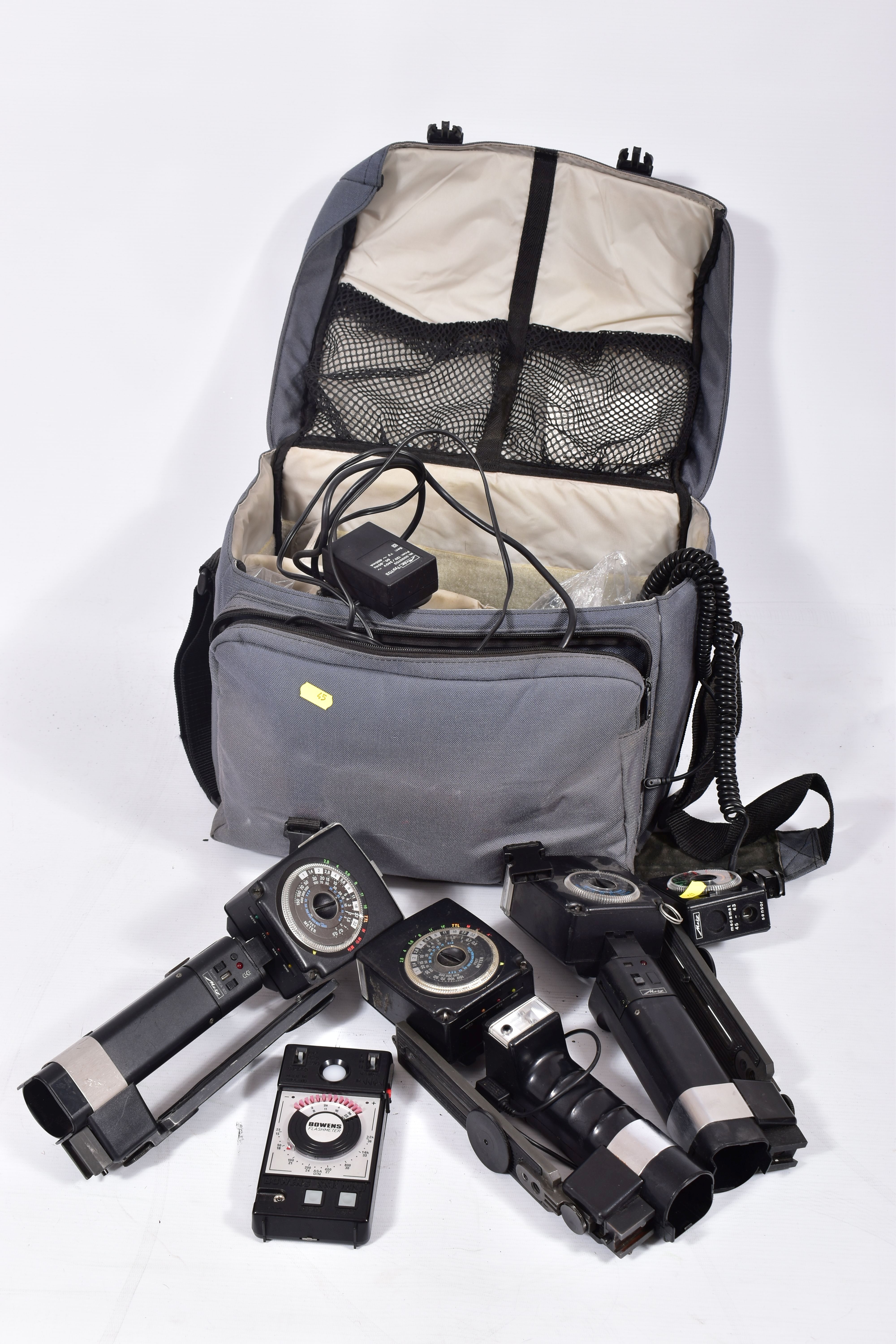 A PADDED CAMERA BAG CONTAINING METZ FLASH EQUIPMENT including two 45CT-4, a 45CT-1, a SCA 300C