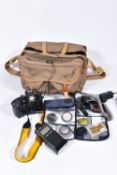 A BILINGHAM CANVAS BAG CONTAINING A NIKON F4 FILM SLR CAMERA with an MB21 winder, a Nikkor AF 50mm